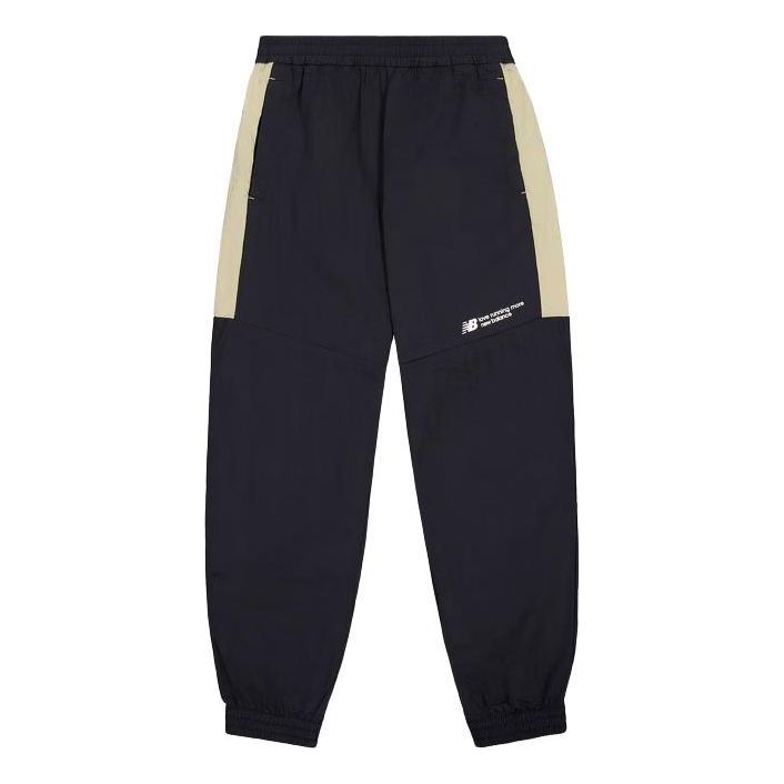 Tepláky New Balance Woven Track Pants Modrá | NTE24031-BK, 0