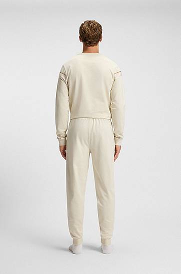 Tepláky BOSS Cotton-terry tracksuit bottoms with side tape and vertical logo Béžová | 50550613, 1