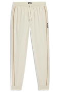 Cotton-terry tracksuit bottoms with side tape and vertical logo