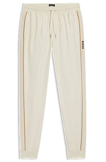 Tepláky BOSS Cotton-terry tracksuit bottoms with side tape and vertical logo Béžová | 50550613