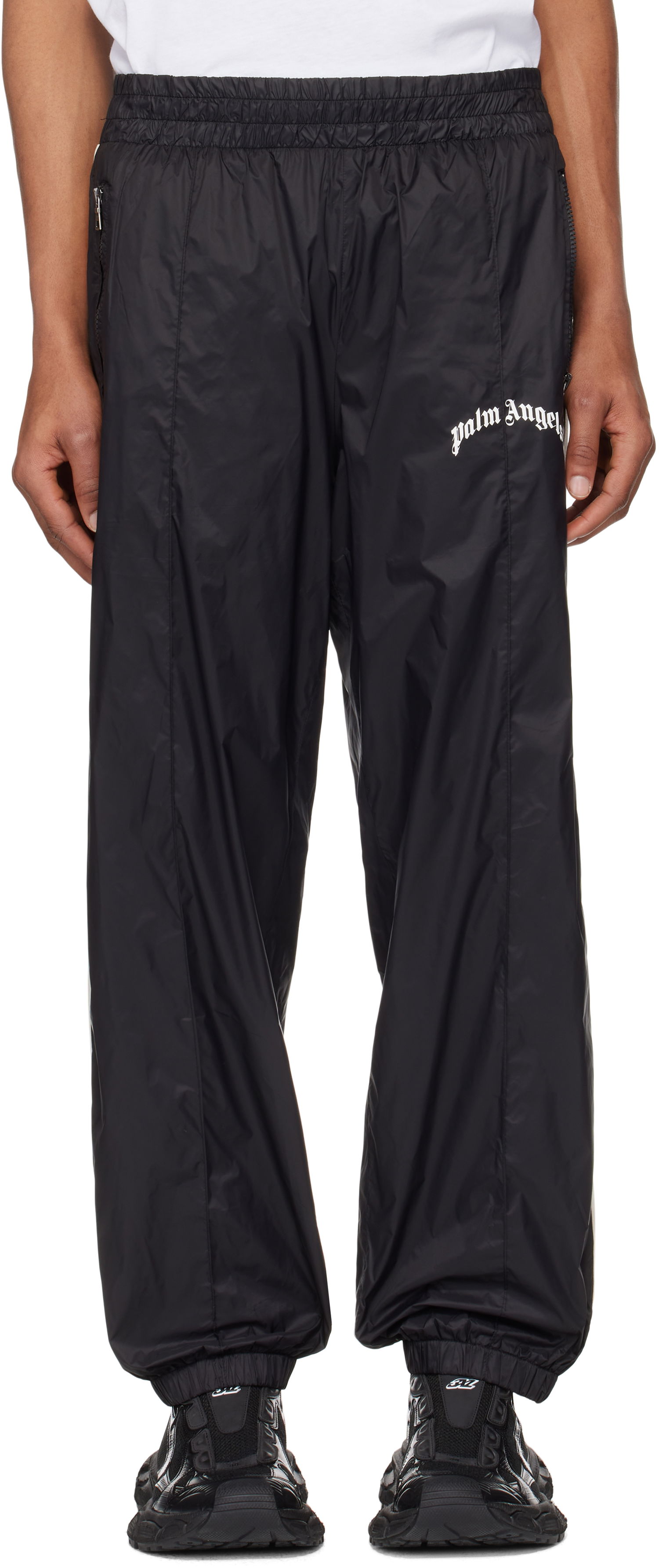 Tepláky Palm Angels Palm Angels Curved Logo Nylon Track Pants Čierna | PMCA179S25FAB0011009, 0
