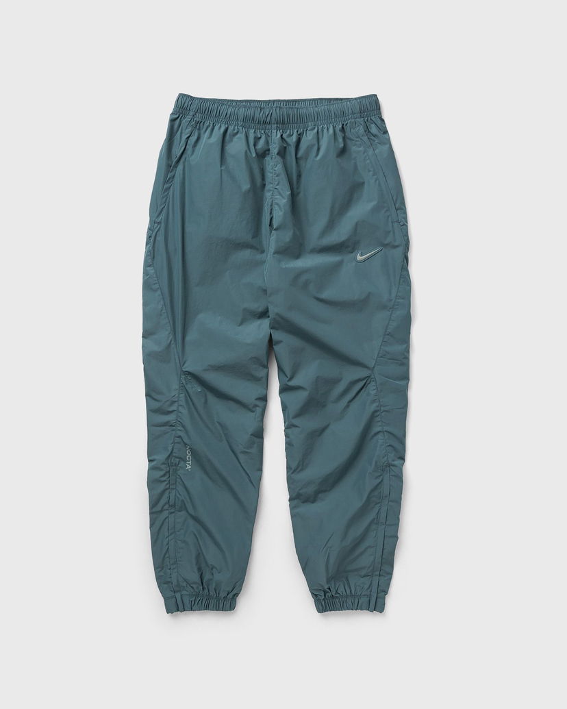 Tepláky Nike NOCTA x NORTHSTAR NYLON TRACKSUIT BOTTOMS Tyrkysová | FN7668-382