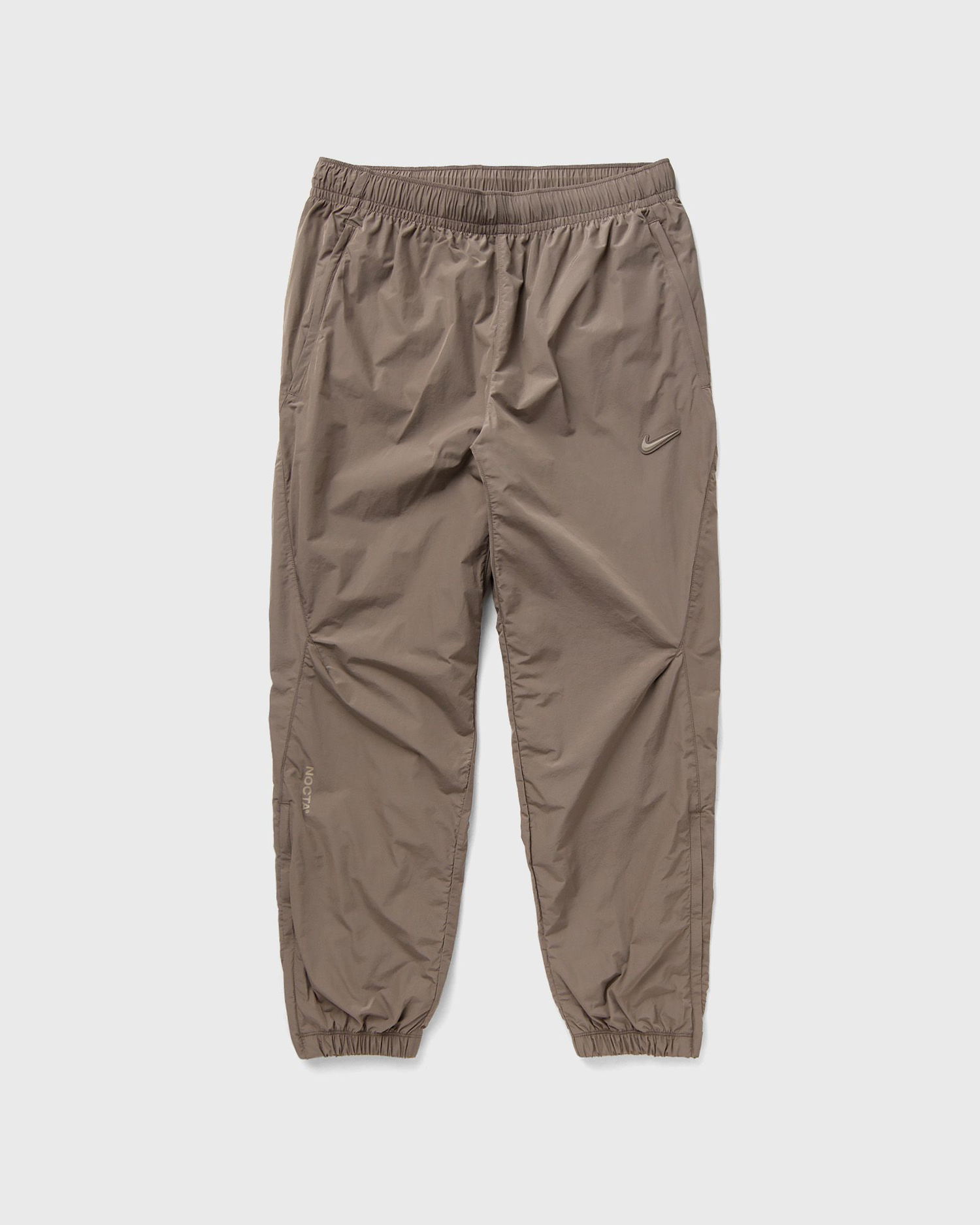 Tepláky Nike NOCTA x NORTHSTAR NYLON TRACKSUIT BOTTOMS Hnedá | FN7668-040, 0