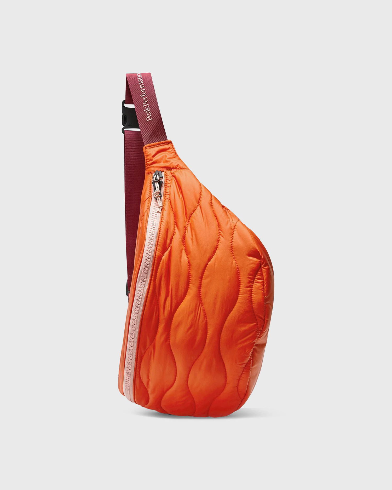 Taška cez rameno Peak Performance HeliuBuBag Quilted Sling Bag Oranžová | G80248070, 0