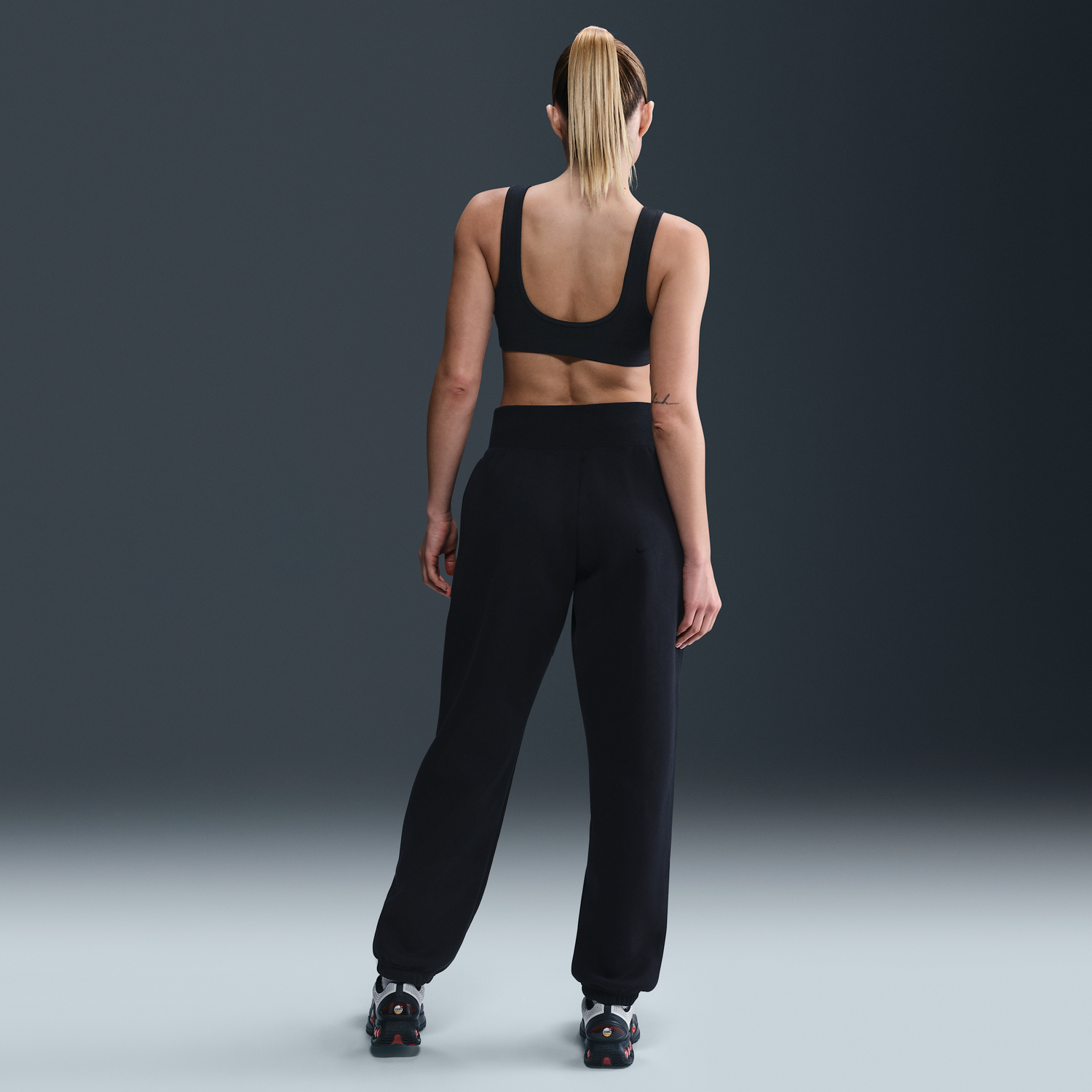 Tepláky Nike England Phoenix Fleece High-Waisted Loose Football Pants Čierna | HF5065-010, 1