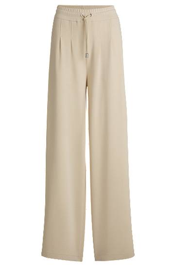 Nohavice BOSS Wide-Leg Tracksuit Bottoms with Pleats Béžová | 50531832, 0