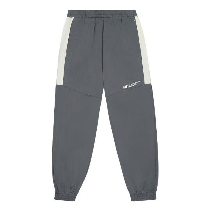 Tepláky New Balance Woven Track Pants Šedá | NTE24031-DKG, 0