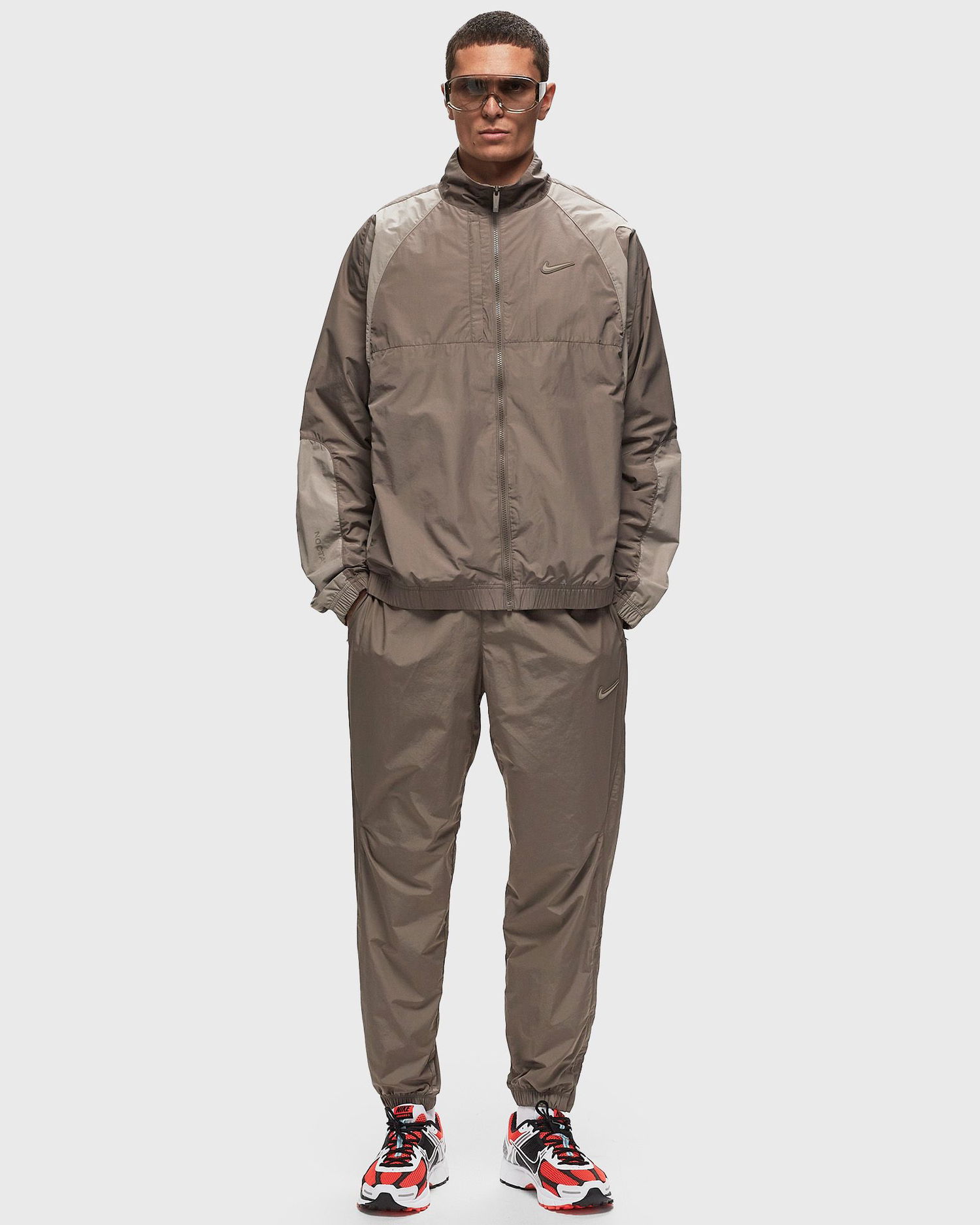 Tepláky Nike NOCTA x NORTHSTAR NYLON TRACKSUIT BOTTOMS Hnedá | FN7668-040, 1