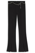 Flared trousers with front slits and chain belt