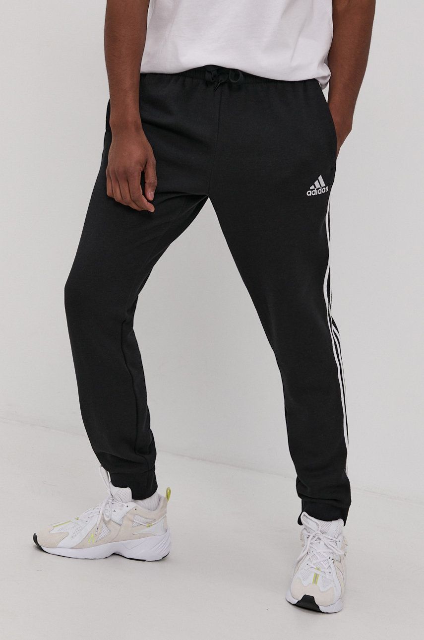 Nohavice a džínsy adidas Performance Essentials French Terry Tapered Cuff 3 Stripes Čierna | GK8821, 0