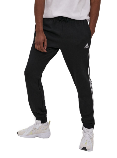 Nohavice a džínsy adidas Performance Essentials French Terry Tapered Cuff 3 Stripes Čierna | GK8821