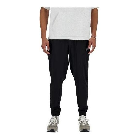 Tepláky New Balance Sport Essentials Woven Joggers Čierna | MP41011-BK