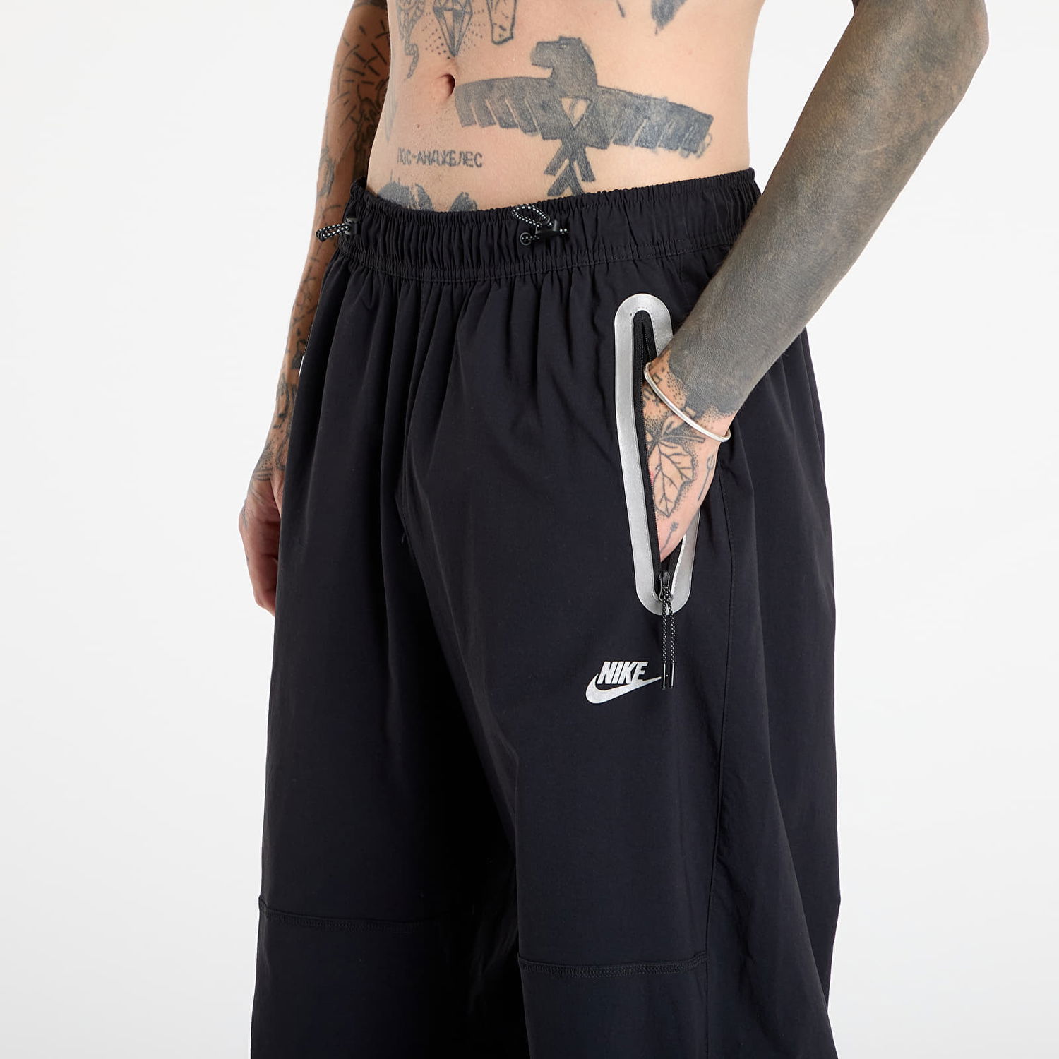 Nohavice Nike NRG TECH Woven Pants with Zippered Pockets Čierna | IM7259-010, 1