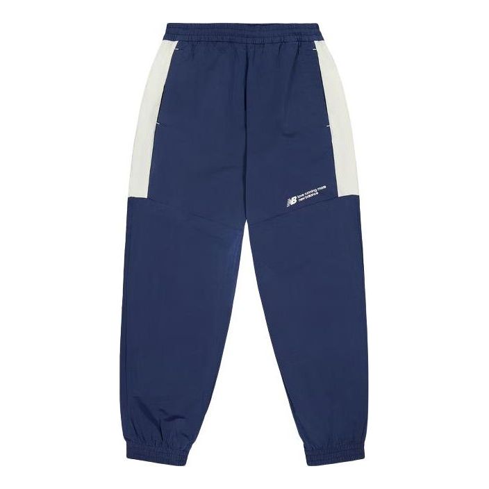 Tepláky New Balance Woven Track Pants Modrá | NTE24031-NV, 0