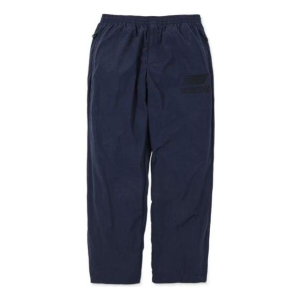 Tepláky New Balance N.HOOLYWOOD x INVINCIBLE(R) Woven Pants Modrá | AMP22346-PCT, 0
