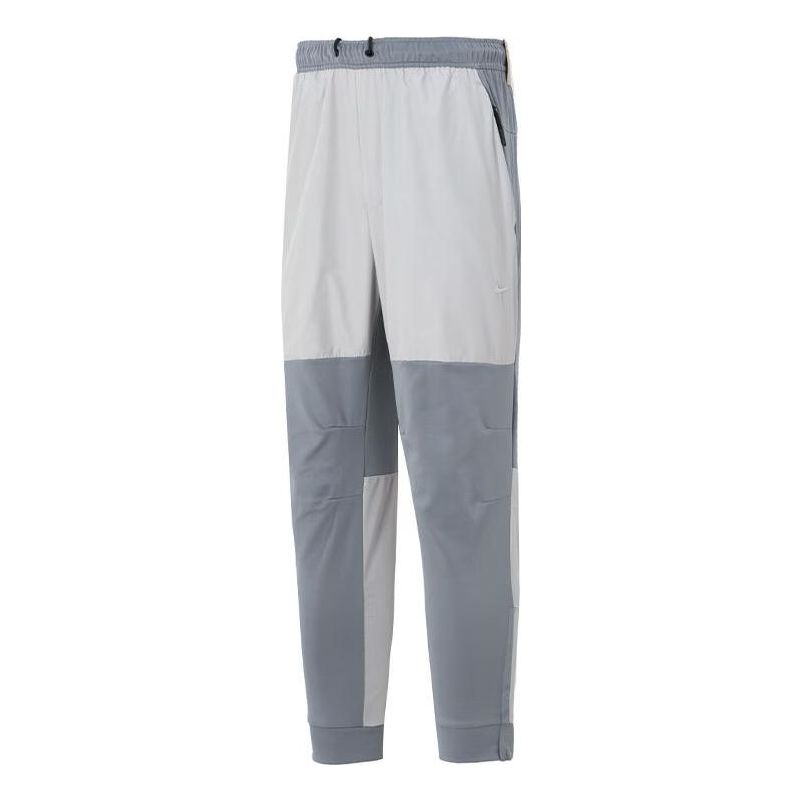 Nohavice Nike Unlimited Water-Repellent Zippered Cuff Pants Šedá | FB8602-084