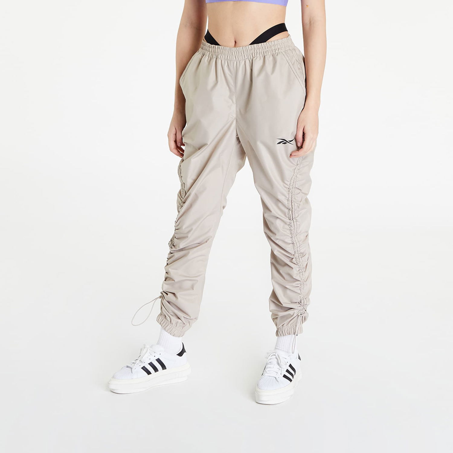 Nohavice a džínsy Reebok Woven Pants Beige x Cardi B Béžová | HM5047, 0