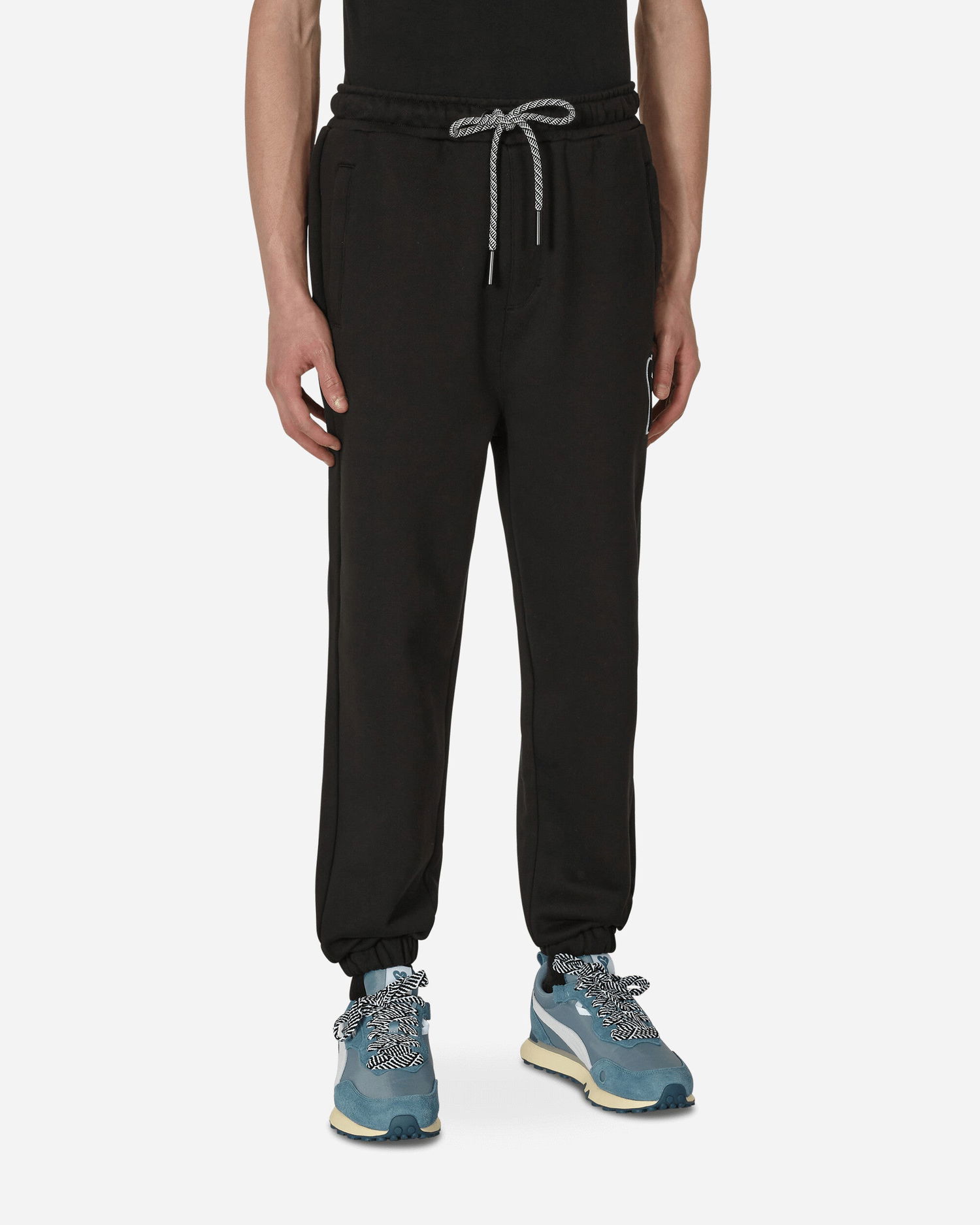 Nohavice a džínsy Puma AMI x Sweatpants Čierna | 535996-01, 0